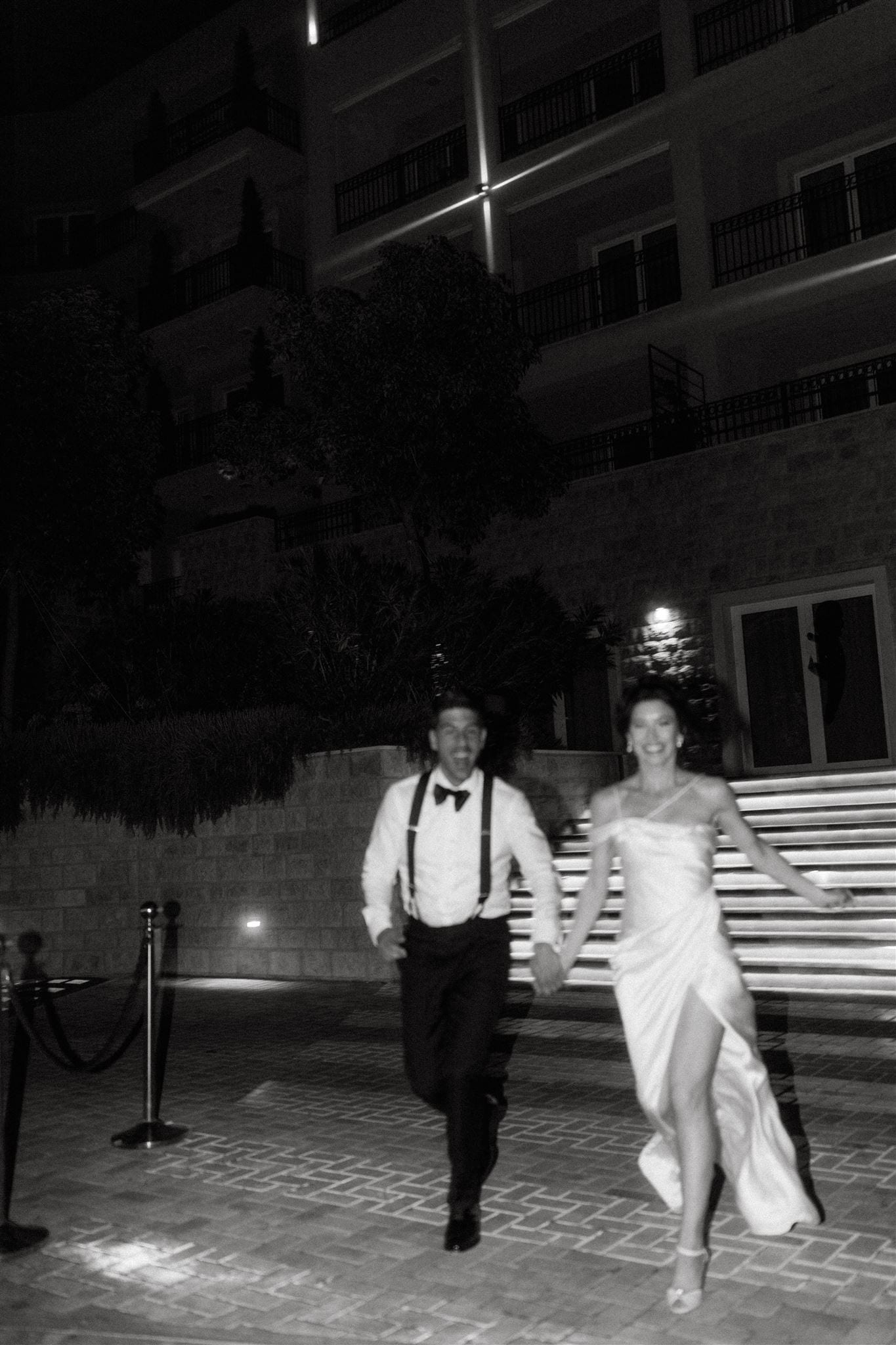 Black and white wedding afterparty moment outside a Montenegro venue