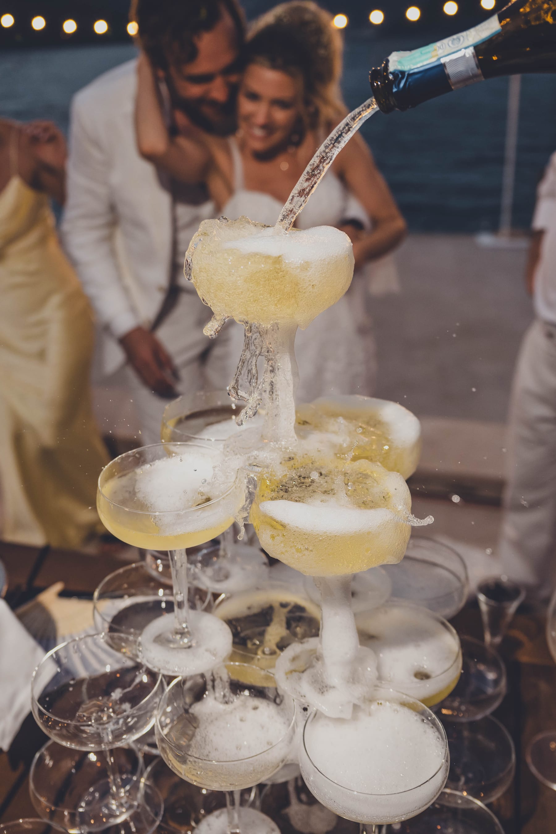 Guests at the champagne tower during a Montenegro wedding celebration